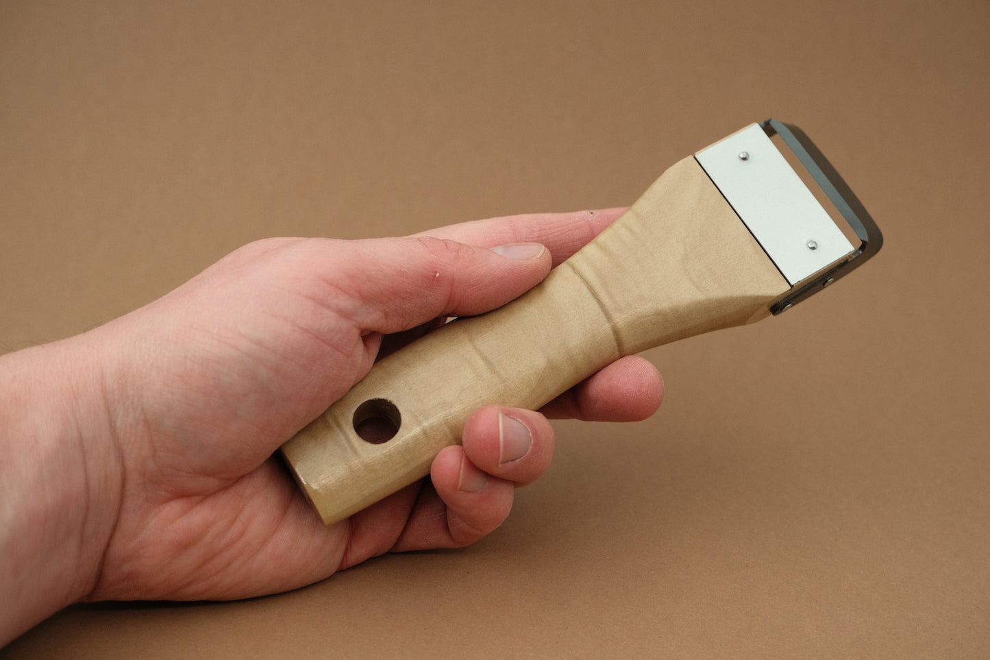 Forged peeler with magnolia wooden handle