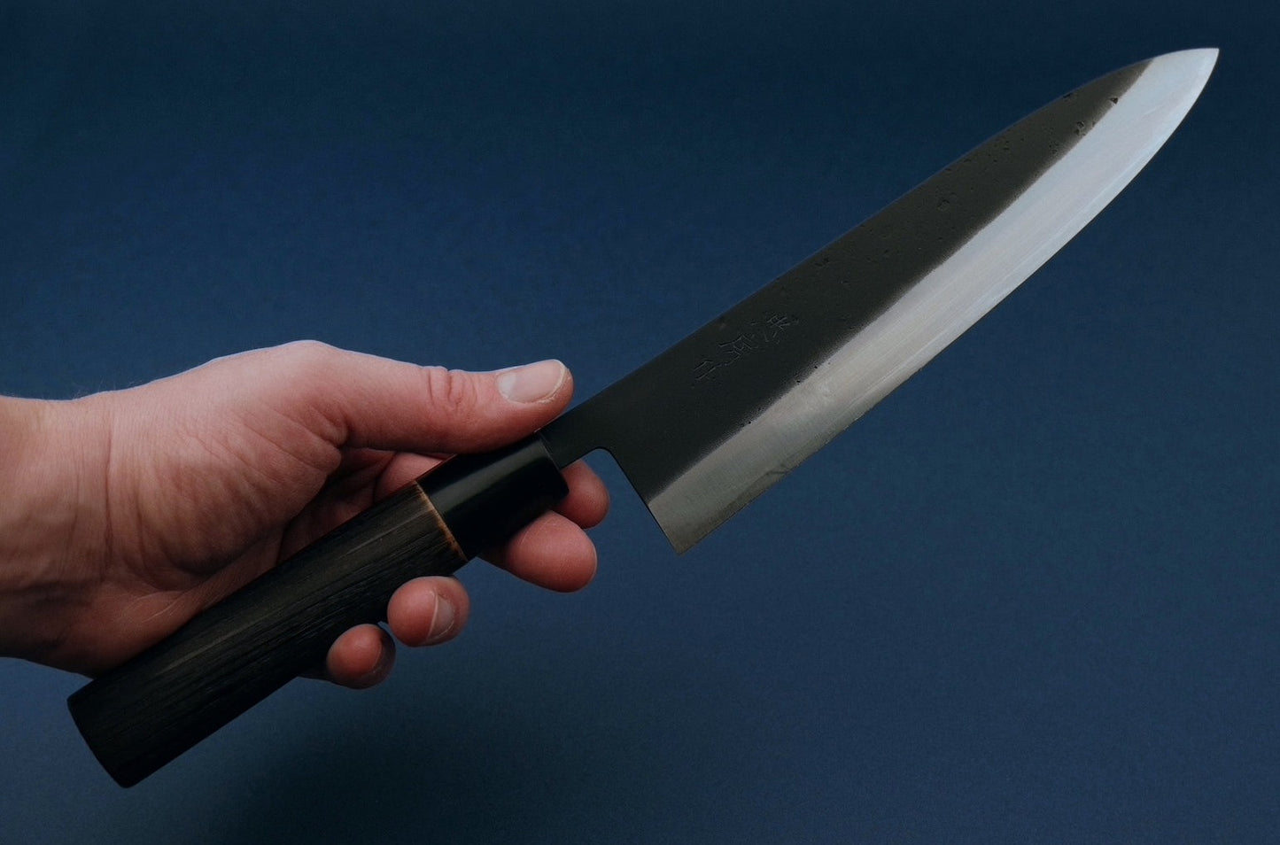 Tadafusa black nashiji SLD gyuto with a burned chestnut oval handle and buffalo horn collar 210 mm
