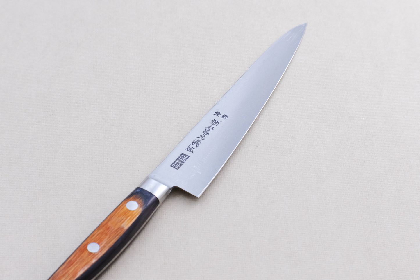 Yamawaki SK4 petty 150 with a pakka handle