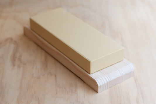 White aluminum oxide whetstone 6000 grit on a wooden base