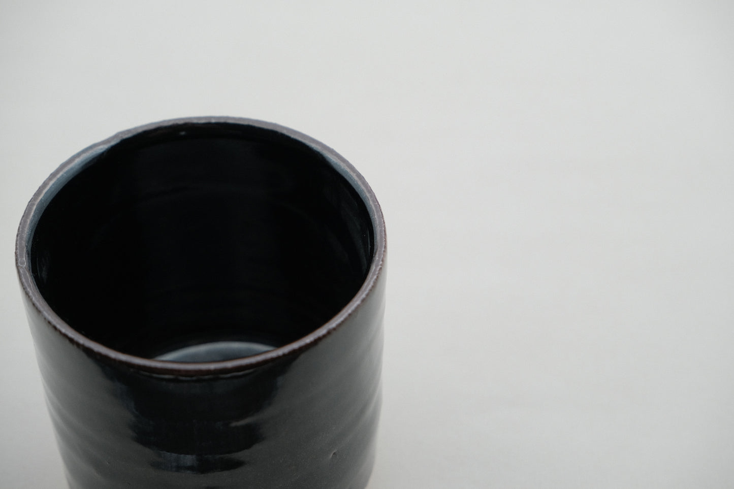 Azmaya Igayaki small straight teacup with a black glaze made at the Kōbo kiln in Mie