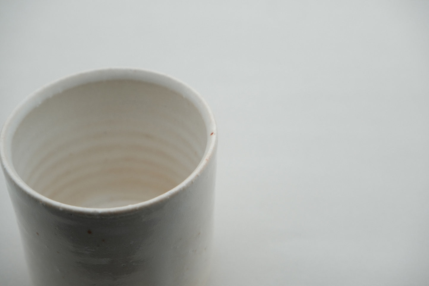 Azmaya Igayaki small straight teacup with a white glaze made at the Kōbo kiln in Mie