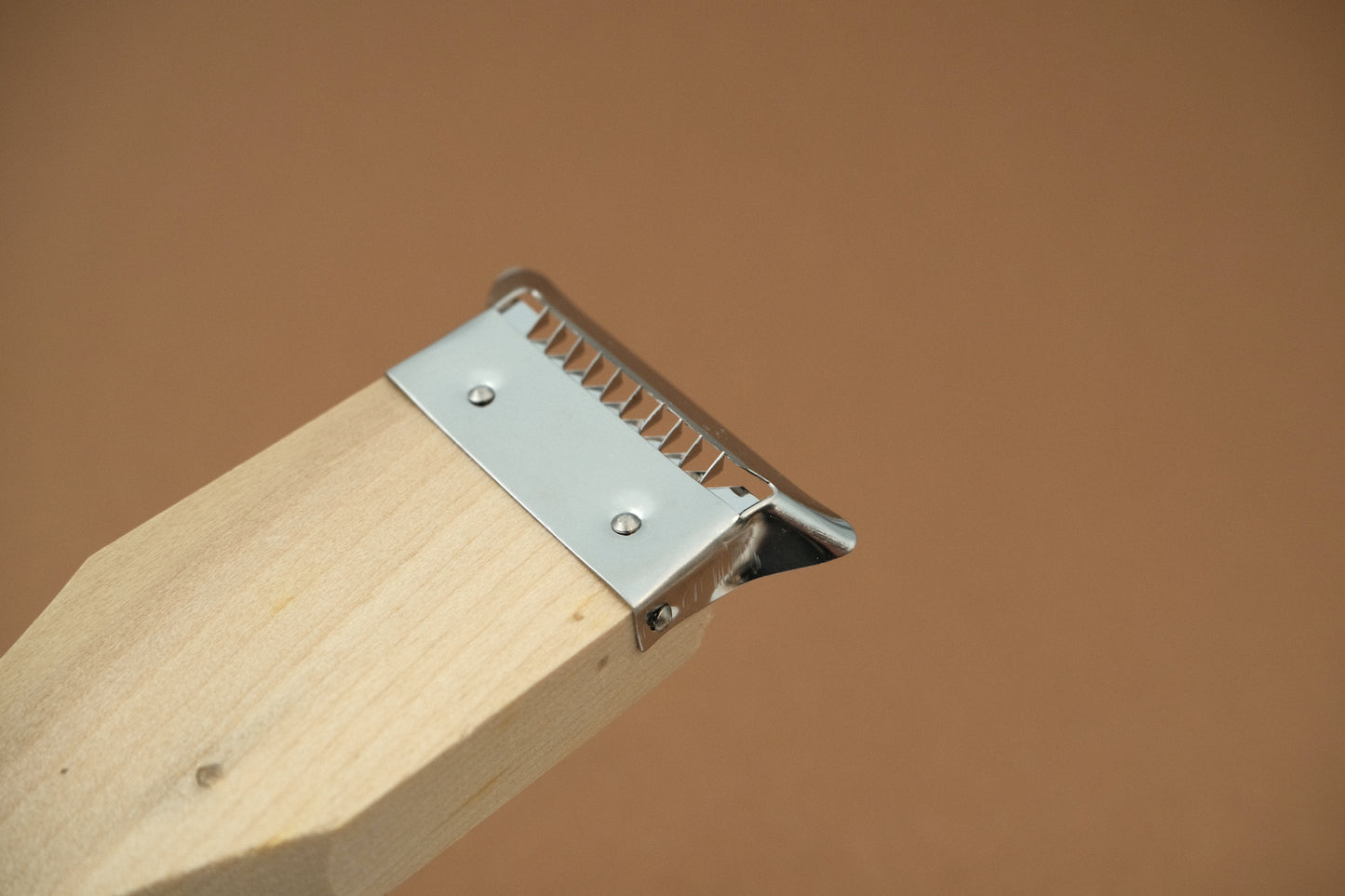 Double sided peeler with a magnolia wooden handle